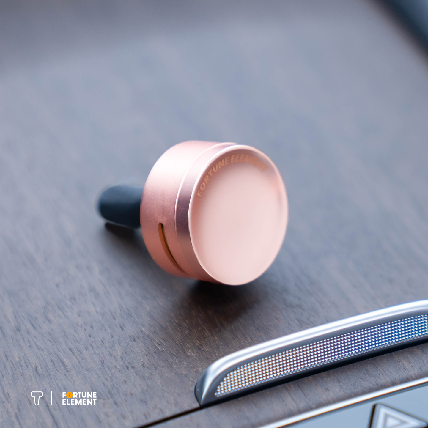 A close-up shot of the car diffuser resting on a wooden surface, showcasing its sleek design and elegant placement.